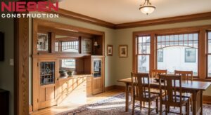 Craftsman-style home interior showing restored original wood trim, built-in cabinetry, and period-appropriate crown molding, warm natural lighting, architectural photography style, photorealistic.